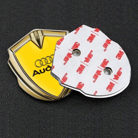 Audi Fender Emblem Badge Gold Yellow Background Black Logo Design