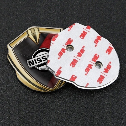 Nissan Emblem Trunk Badge Gold Dark Red Scratched Surface Design