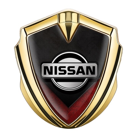 Nissan Domed Emblem Gold Ribbed Base Red V Shaped Element
