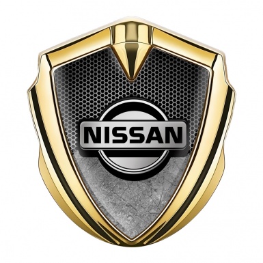 Nissan Emblem Ornament Gold Grey Honeycomb Scratched Surface