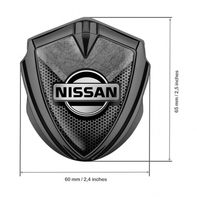 Nissan Bodyside Domed Emblem Graphite Hexagon Texture Stone Fragment