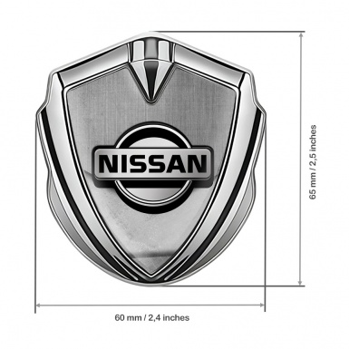 Nissan Emblem Car Badge Silver Stone Slab Tarmac Texture Design