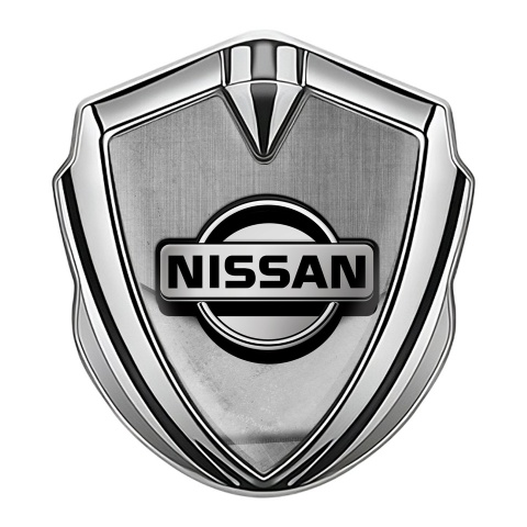 Nissan Emblem Car Badge Silver Stone Slab Tarmac Texture Design