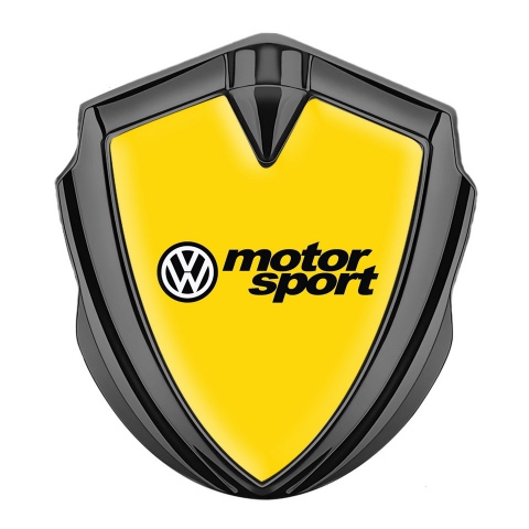 VW Domed Emblem Graphite Yellow Background Motorsport Logo Design