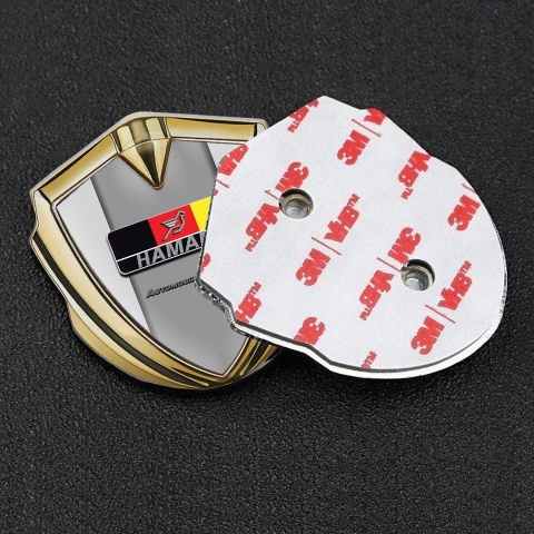 Hamann Emblem Abzeichen Goldtonfarbe Grau Basis mit Deutsch Logo Motiv