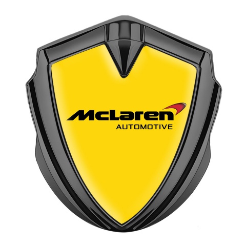 Mclaren Metal Domed Emblem Graphite Yellow Background Classic Logo