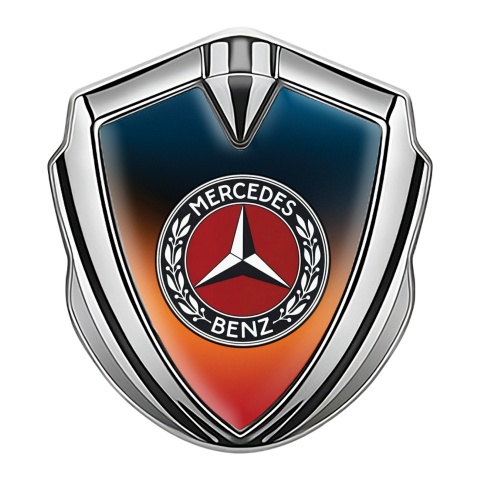 Mercedes Benz Emblem Abzeichen Silbertonfarbe mit Schillerndes Orangeblau Hintergrund Design