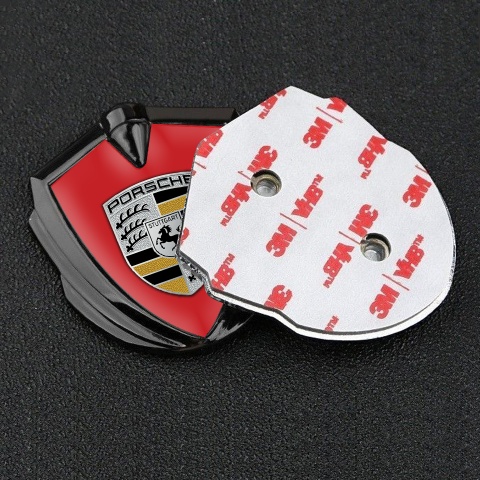 Porsche Emblem Abzeichen selbstklebend Graphit Tonfarbe mit Rote Hintergrund und  Schwarz Gelb Logo Stil