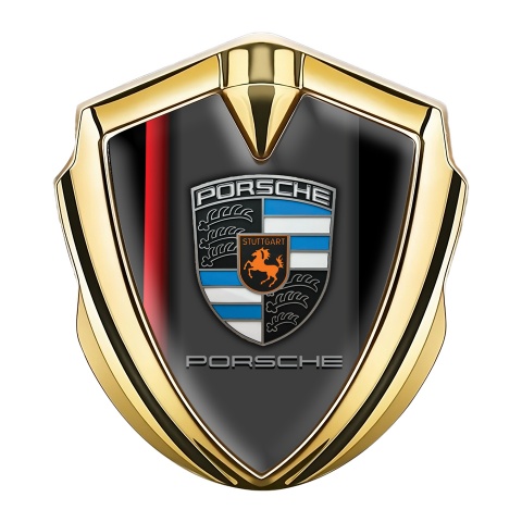 Porsche Abzeichen selbstklebend Goldtonfarbe mit Schwarz Rote Elemente Hintergrund