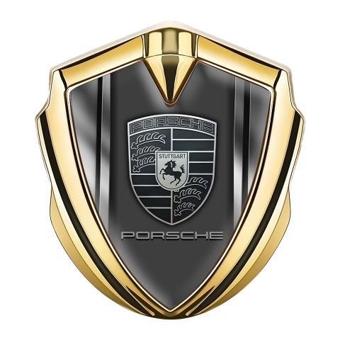 Porsche Abzeichen selbstklebend Goldtonfarbe mit Metallseiten Basis und monochromes Logo Stil