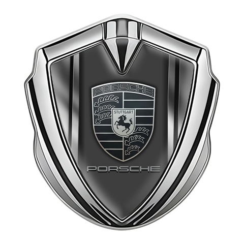 Porsche Abzeichen selbstklebend Silbertonfarbe mit Metallseiten Basis und monochromes Logo Stil