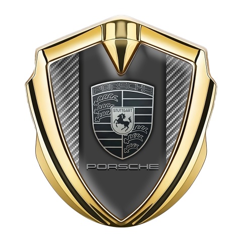 Porsche Emblem Abzeichen selbstklebend Goldtonfarbe mit Kohlenstoff Hintergrund und Monochromes Logo