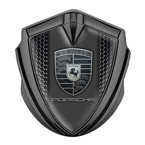 Porsche Emblem Auto Zeichen Graphit Tonfarbe mit Perforierter Stahl Hintergrund und Monochromes Logo