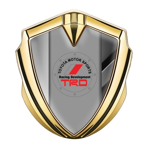 Toyota Emblem Logo Schriftzug Aufkleber Goldtonfarbe mit Metallformen Hintergrund und TRD Logo