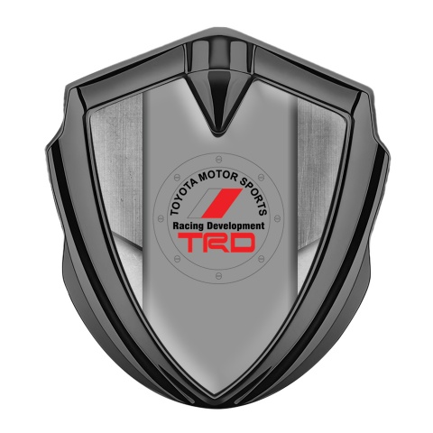Toyota Emblem Auto Zeichen Graphit Tonfarbe mit Steinplattenmotiv Hintergrund und TRD Logo