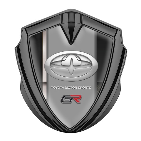 Toyota GR Emblem Abzeichen selbstklebend Graphit Tonfarbe mit Graue Linie der Basis und Neues Design Logo
