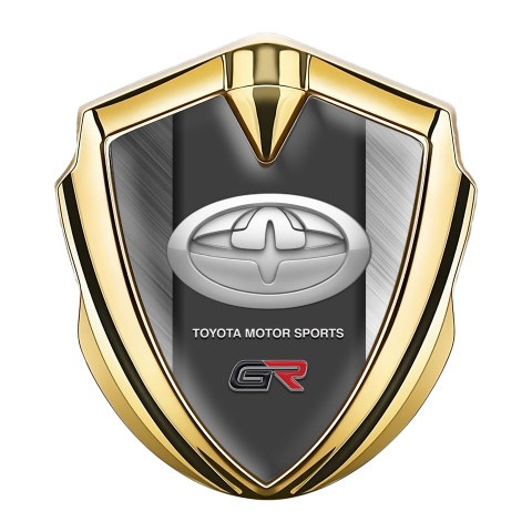 Toyota GR Emblem Abzeichen Goldtonfarbe mit Gebursteter Stahl Hintergrund und Modernes Logo