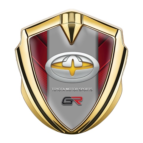 Toyota GR Abzeichen selbstklebend Goldtonfarbe mit Rote Elemente und Gelb Motiv Logo