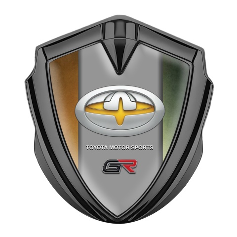 Toyota GR Seitenflugel Emblem Aufkleber Graphit Tonfarbe mit Braun Grun Basis und Gelb Logo Motiv