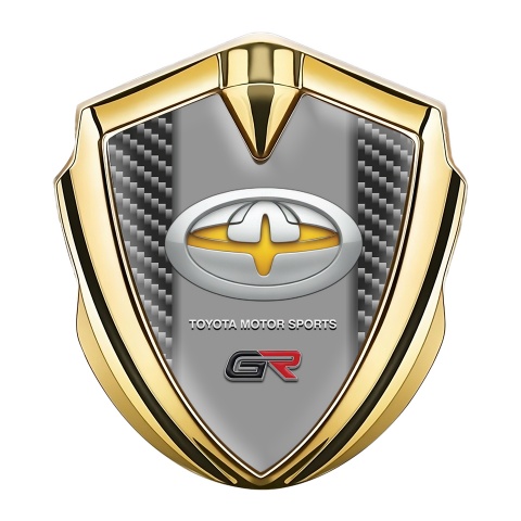 Toyota GR Emblem Abzeichen Goldtonfarbe mit Dunkles Carbon Basis und Gelb Logo Motiv