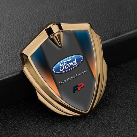 Ford FP Abzeichen selbstklebend Goldtonfarbe mit Schillerndes Orangeblau Hintergrund und Craphit Logo Panel