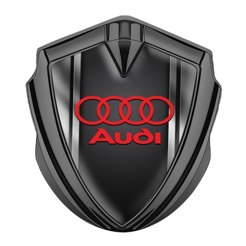 Audi Emblem Auto Zeichen Graphit Tonfarbe mit Metallrahmen Fundaments und Rote Logo