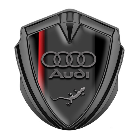 Audi Emblem Abzeichen Graphit Tonfarbe mit Roter Schatten Basis Design und Eidechse im Logo