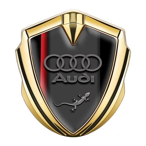 Audi Emblem Abzeichen Goldtonfarbe mit Roter Schatten Basis Design und Eidechse im Logo