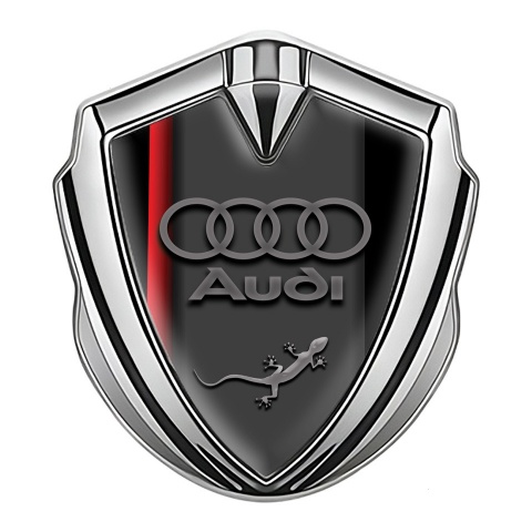 Audi Emblem Abzeichen Silbertonfarbe mit Roter Schatten Basis Design und Eidechse im Logo