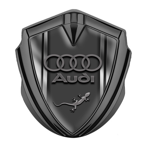 Audi Abzeichen selbstklebend Graphit Tonfarbe mit Metallrahmen Basis Effekt und Eidechse Logo