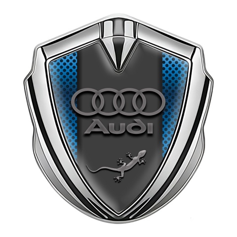 Audi Quattro Emblem Auto Zeichen Silbertonfarbe mit Blau Netzwerk Hintergrund Design und Eidechse Logo