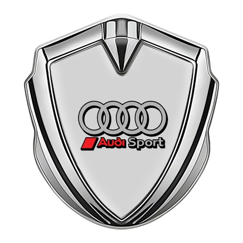 Audi Emblem Auto Zeichen Silbertonfarbe mit Grau Hintergrund und Sport Kreise Auflage