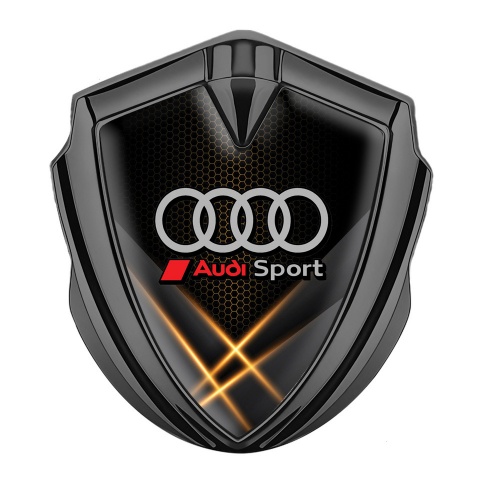 Audi Sport Emblem Abzeichen Graphit Tonfarbe mit Orange Lichter Hintergrund Design