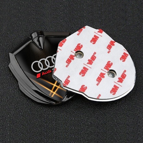 Audi Sport Emblem Abzeichen Graphit Tonfarbe mit Orange Lichter Hintergrund Design