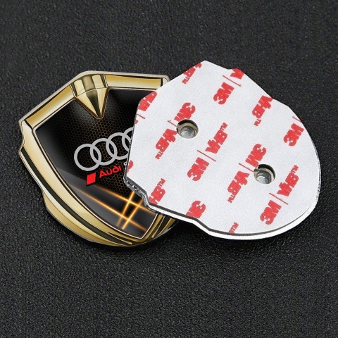 Audi Sport Emblem Abzeichen Goldtonfarbe mit Orange Lichter Hintergrund Design