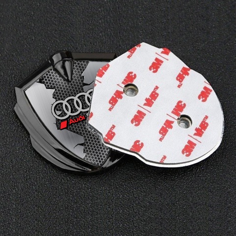 Audi Sport Emblem Abzeichen selbstklebend Graphit Tonfarbe mit Zerrissener Stahl Basis Effekt
