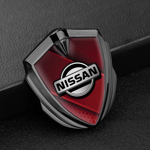 Nissan Emblem Abzeichen Graphit Tonfarbe Rote Diagonale Panel Hintergrund mit Grau logo Stil