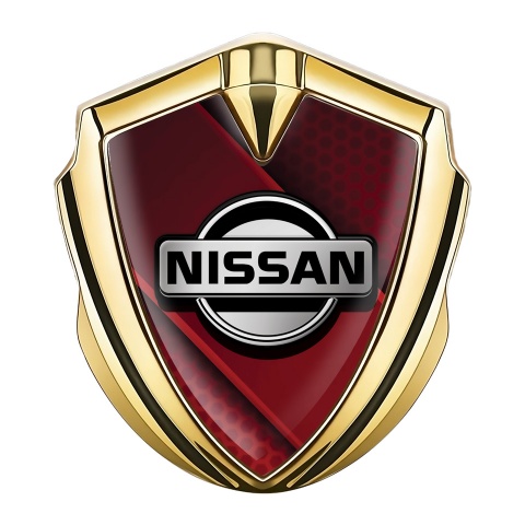 Nissan Emblem Abzeichen Goldtonfarbe Rote Diagonale Panel Hintergrund mit Grau logo Stil