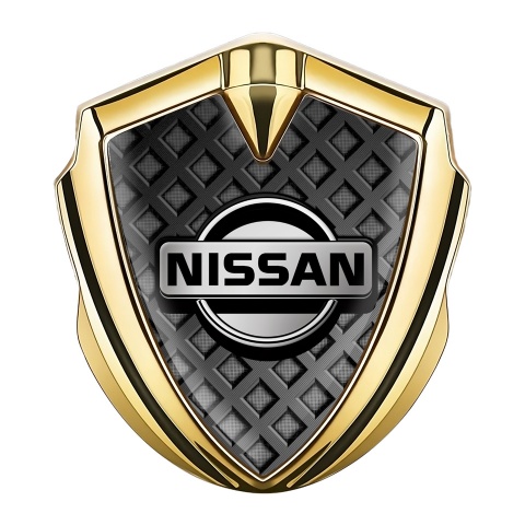Nissan Emblem Auto Zeichen Goldtonfarbe Dunkles Gitter mit Grau Logo