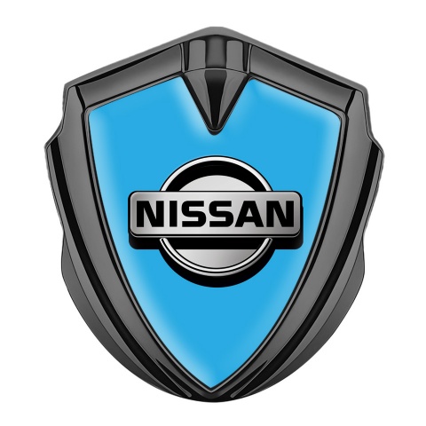 Nissan Emblem Abzeichen selbstklebend Graphit Tonfarbe Blau Fundament mit Grau logo Stil