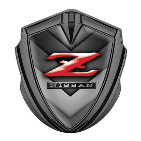 Nissan Z Emblem Abzeichen selbstklebend Graphit Tonfarbe Grau V Form Elemente Hintergrund mit Rote Logo