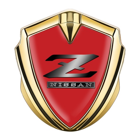 Nissan Z Abzeichen selbstklebend Goldtonfarbe Rote Fundament mit Metall Logo Stil