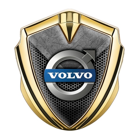 Volvo Emblem Logo Schriftzug Aufkleber Goldtonfarbe Zerkratzter Stein mit gitter Design