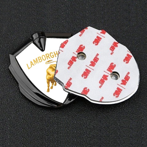 Lamborghini Emblem Abzeichen selbstklebend Graphit Tonfarbe Weiss Hintergrund und Gold Design Logo