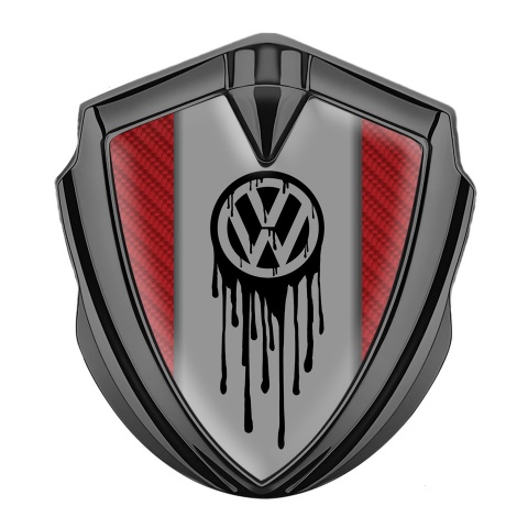 VW Emblem Abzeichen Graphit Tonfarbe mit Rot Kohlenstoff Hintergrund und Tropfende Farbe Logo Effekt