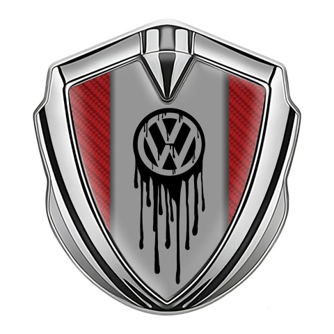 VW Emblem Abzeichen Silbertonfarbe mit Rot Kohlenstoff Hintergrund und Tropfende Farbe Logo Effekt