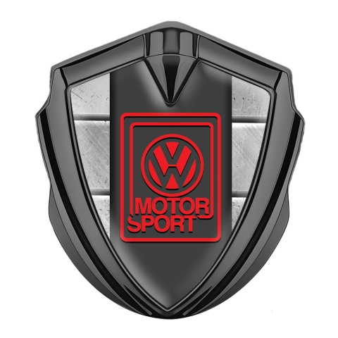 VW  Emblem Abzeichen Graphit Tonfarbe mit Steinplatten Hintergrund Stil und Rot Motor Sport Logo