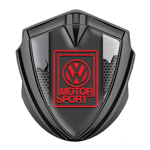 VW Emblem Auto Zeichen Graphit Tonfarbe mit Gebrochener Stahl Hintergrund Design Und Rot Motor Sport logo