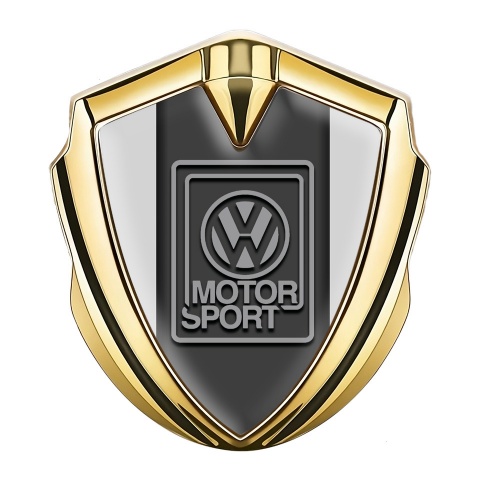 VW Emblem Abzeichen Goldtonfarbe mit Grau hintergrund und Motorsport Logo Auflage