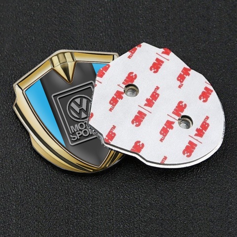VW Emblem Abzeichen selbstklebend Goldtonfarbe mit Himmelblau Basis und Grau Logo Motorsport